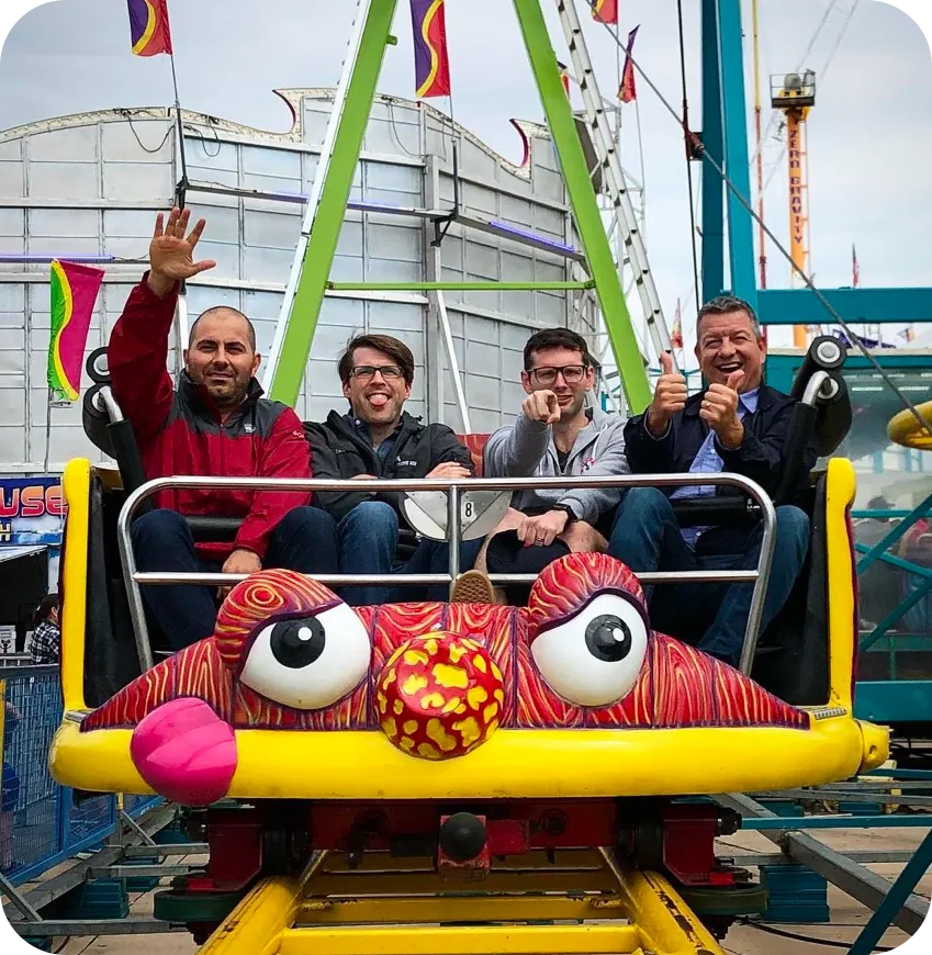 Vinli team riding a roller coaster