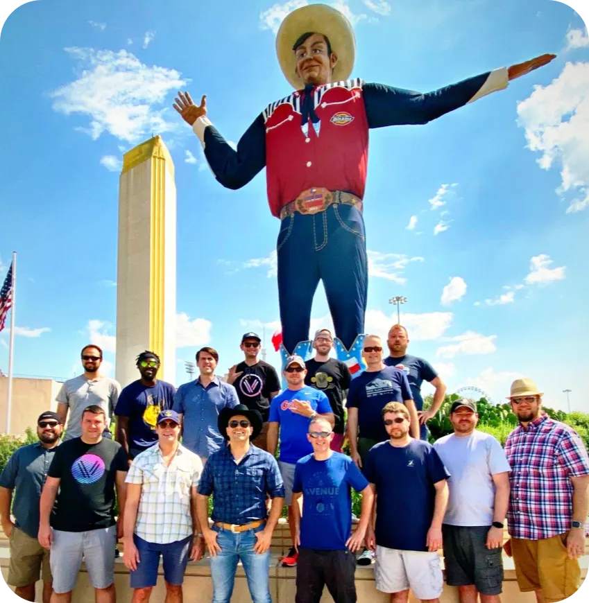 Vinli team in front of 'Big Tex' at the Texas State Fair