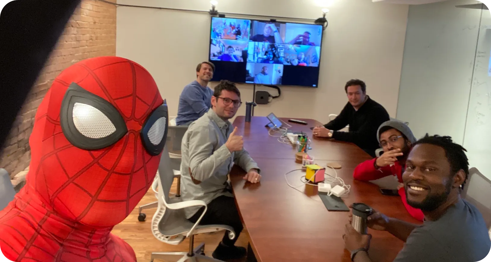 Vinli team in conference room with member dressed as Spiderman